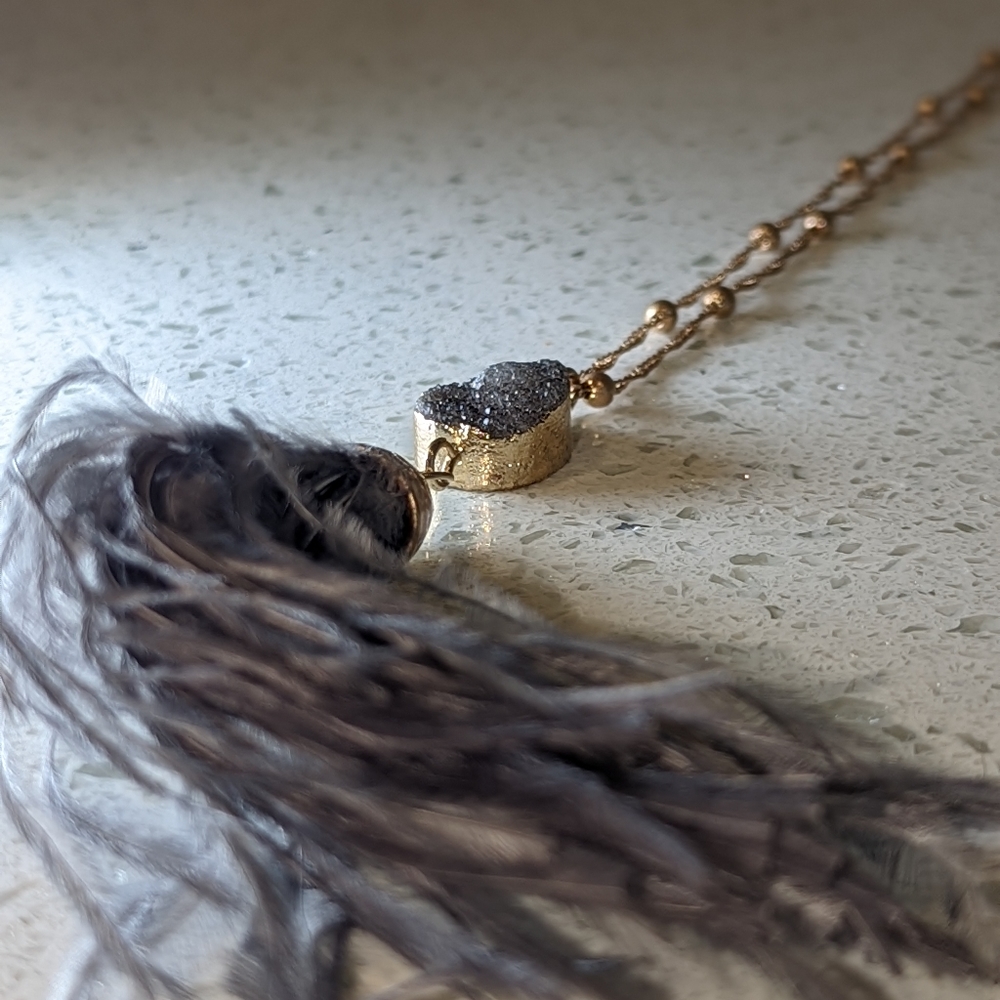 Long necklace with stone/feathered tassel